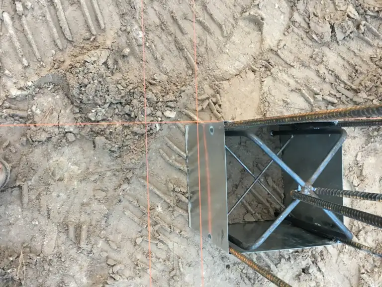 Ty-Rite anchor set in a footing hole with rebar before the concrete pour