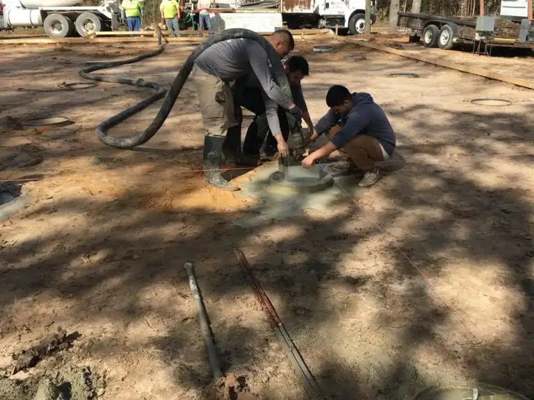 Crew setting Ty-Rite anchors as the concrete trucks arrive