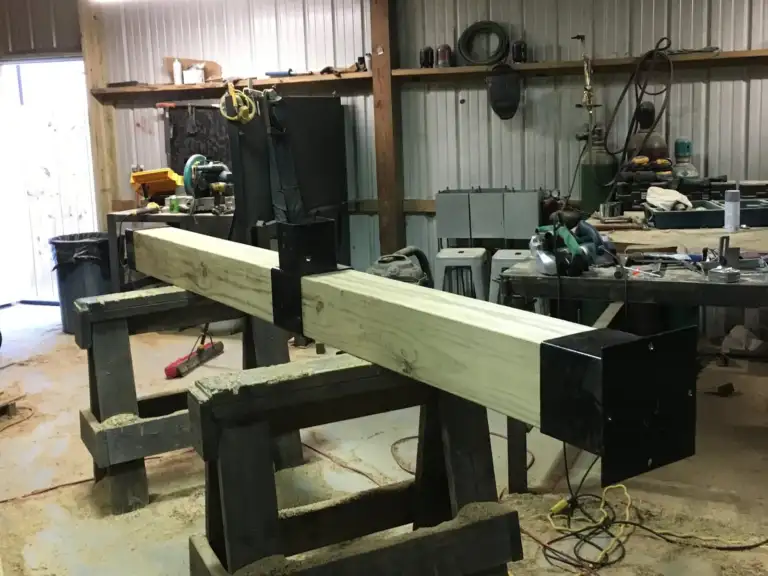 Posts being fitted on sawhorses in the Designs by Vision shop
